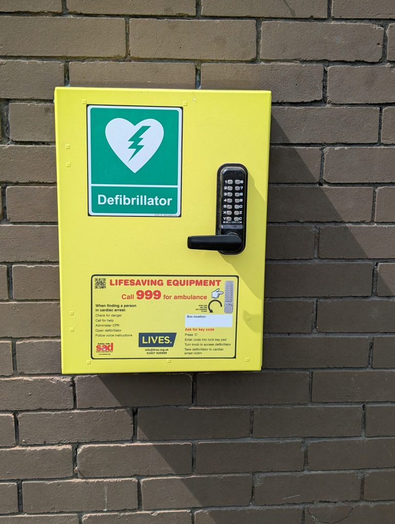 Defibrillator mounted on a brick wall